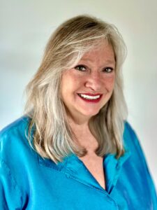 Women in blue blouse. Cindy Lenhart.